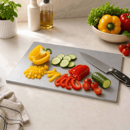 Modern stainless steel meal-preparation board on kitchen counter